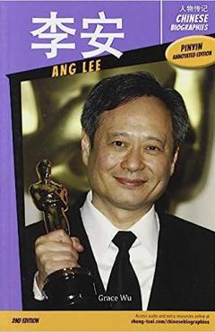 Chinese man in black suit holding up Oscar award