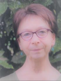 Woman with short hair and glasses